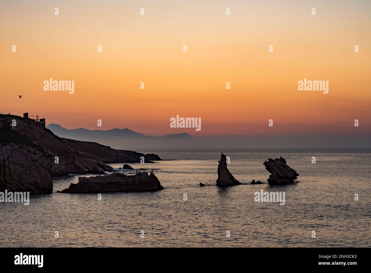 View of the Sicilian coasts and Terrasini stacks at dusk Stock Photo