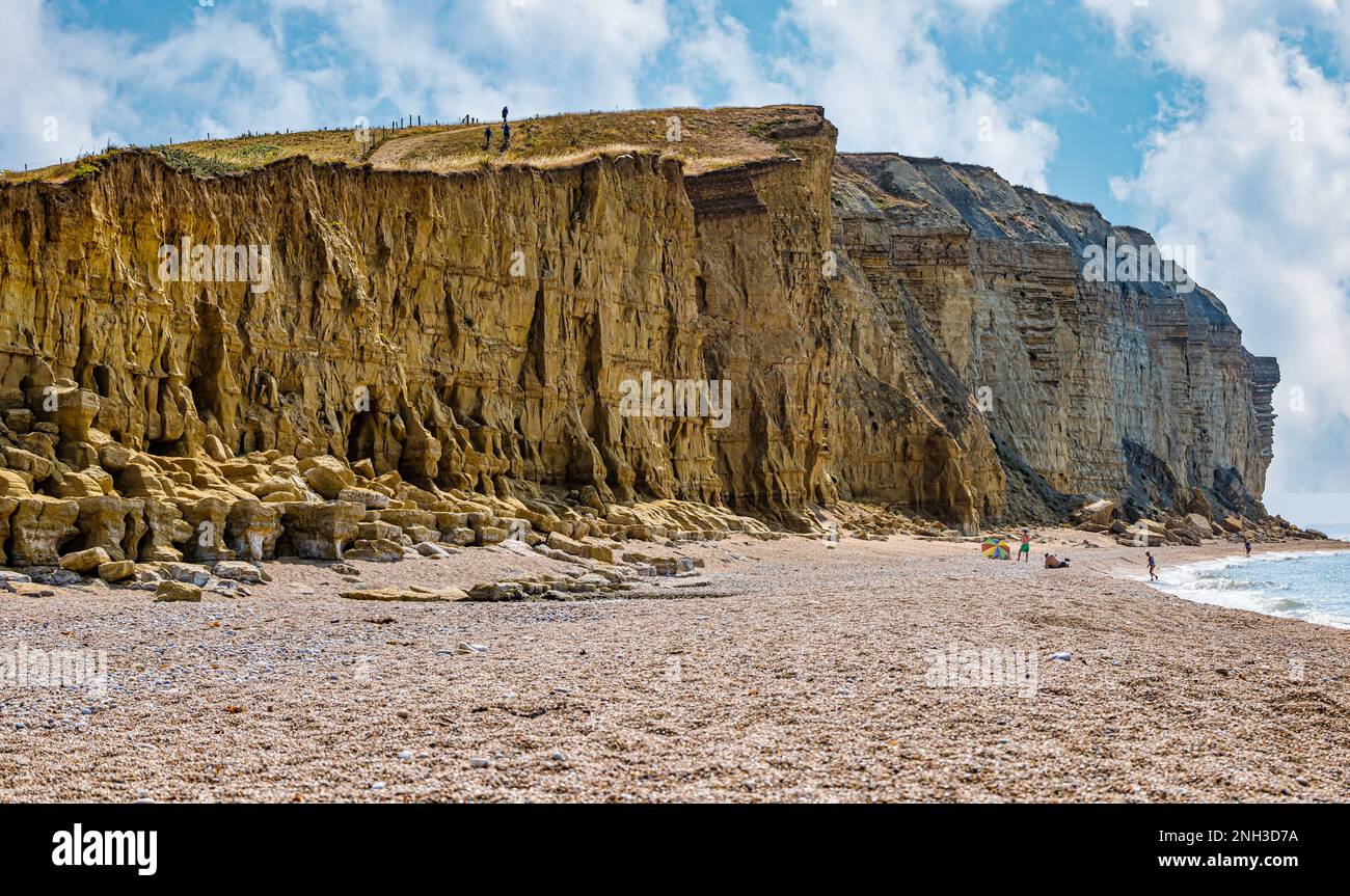 Crumbling limestone cliffs and coastal footpath, Jurassic coast, Burton Freshwater, Dorset, England, UK Stock Photo