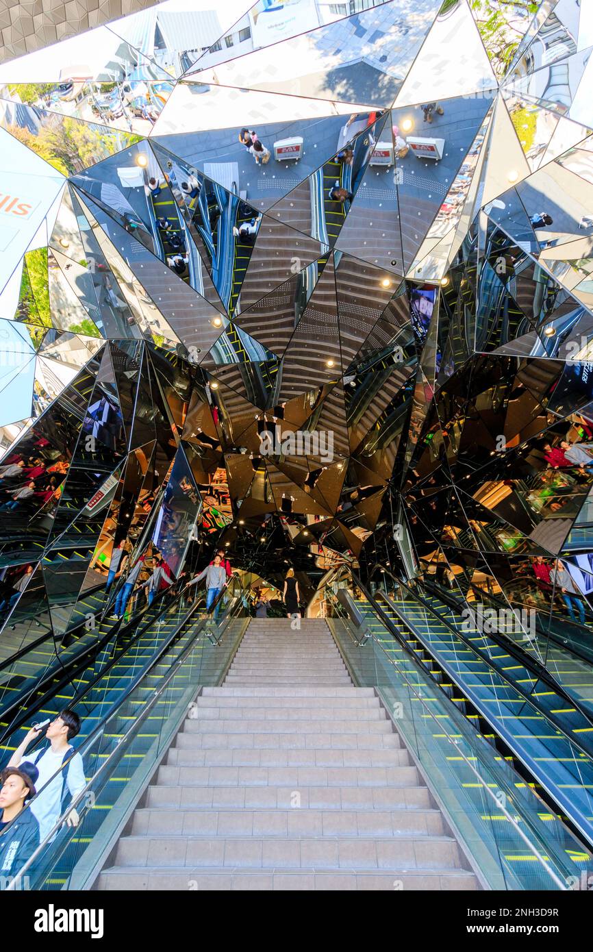Hall of Mirrors entrance at the Tokyu Plaza building in Omotesando, Tokyo. View up the stairs and escalators into the maze of mirrors. Daytime. Stock Photo