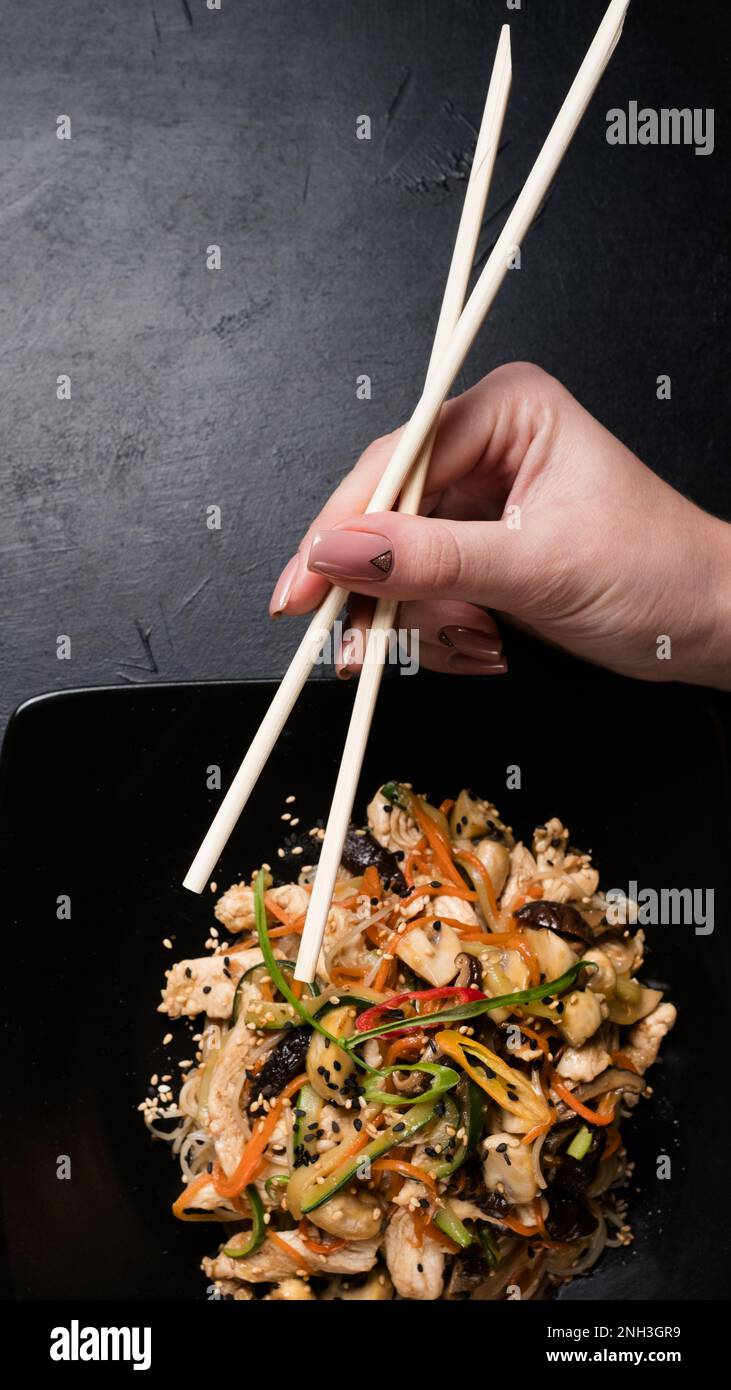 asian food culture eating chopsticks chicken salad Stock Photo Alamy