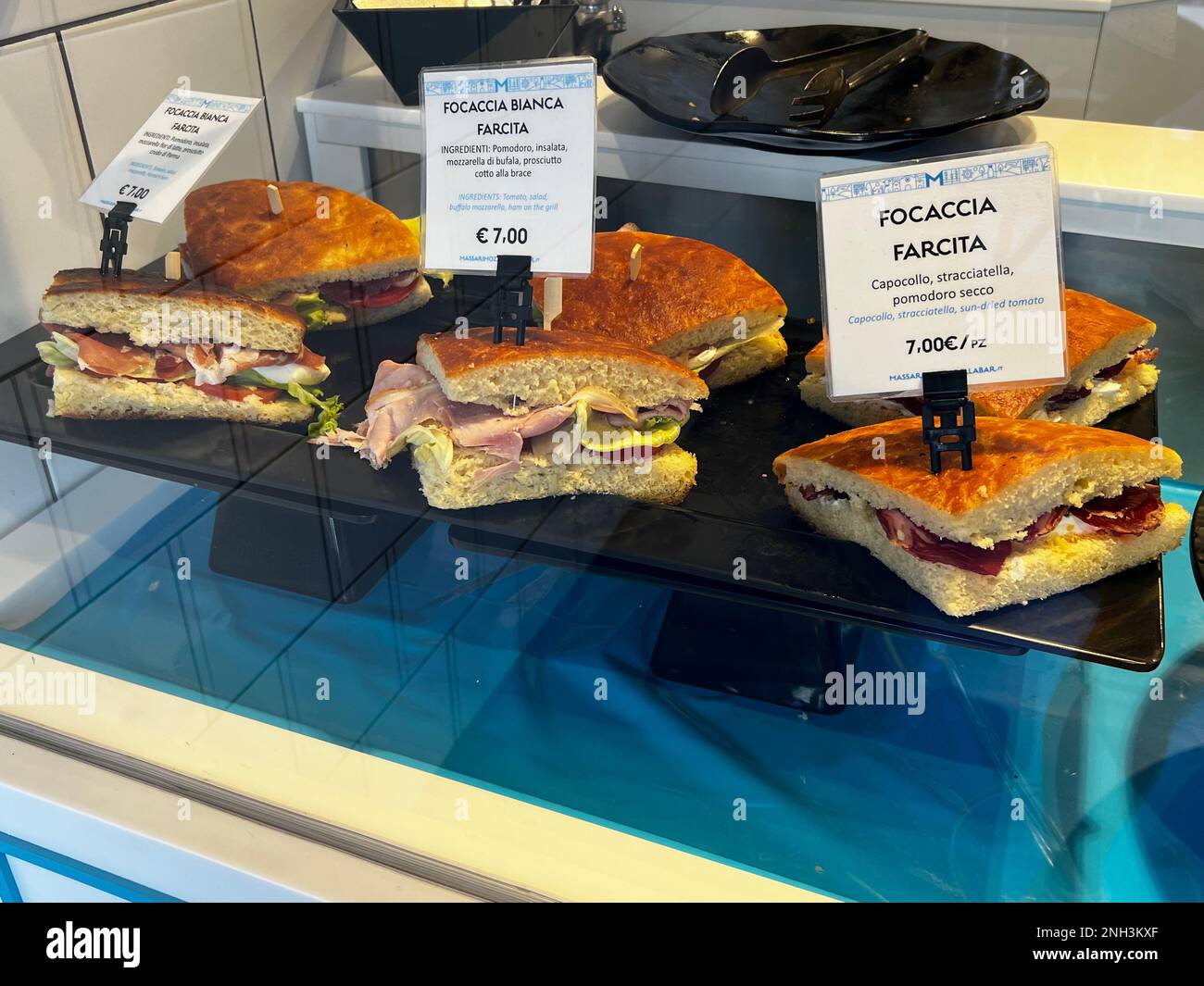 Focaccia sandwiches are displayed at a restaurant in Polignano a Mare, Puglia Italy. Stock Photo