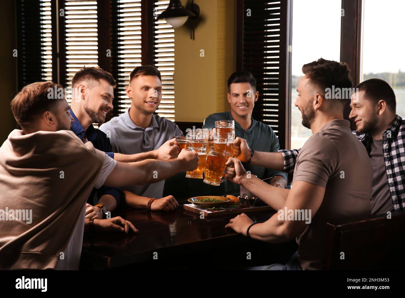 Hands holding clinking beer hi-res stock photography and images - Alamy