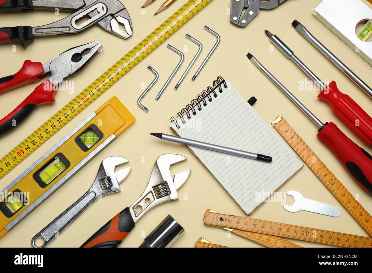 Flat lay composition with different tools on beige background Stock ...