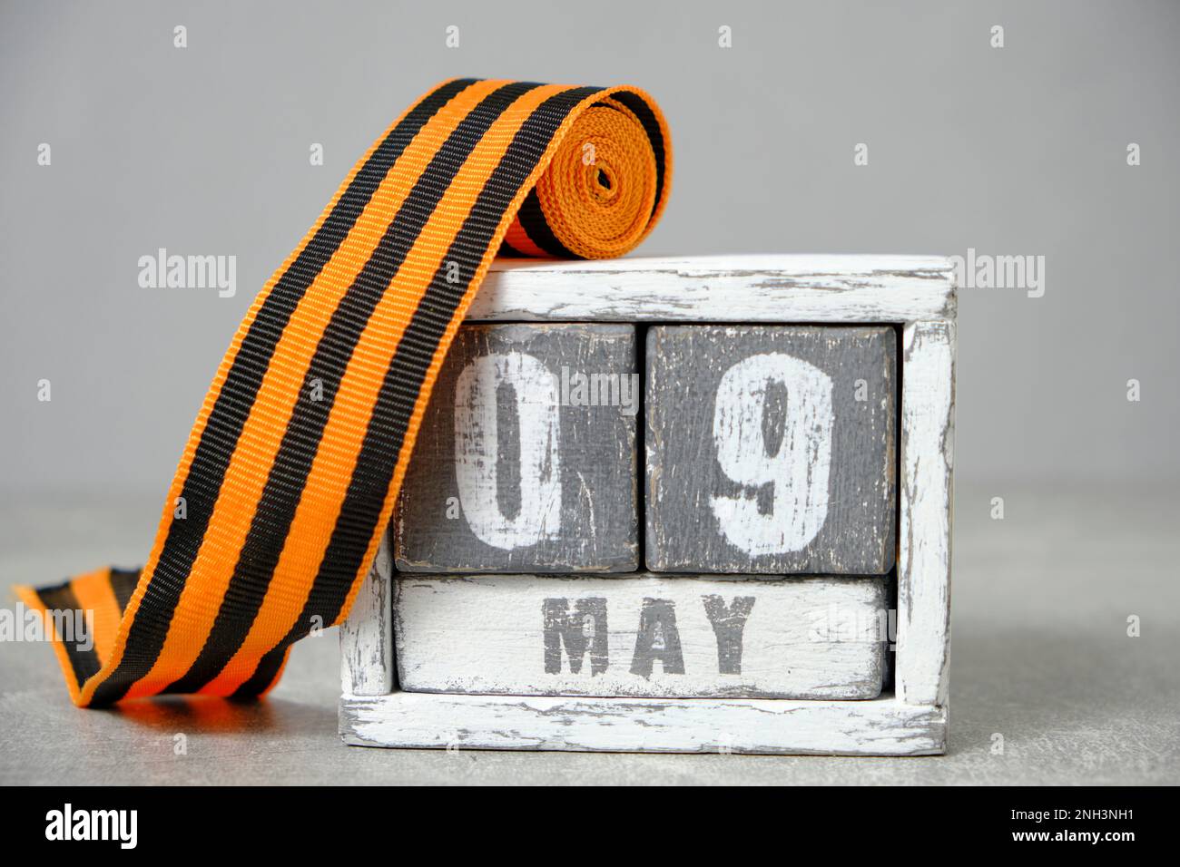 May 09, wooden calendar and St. George ribbon gray background.Concept ...