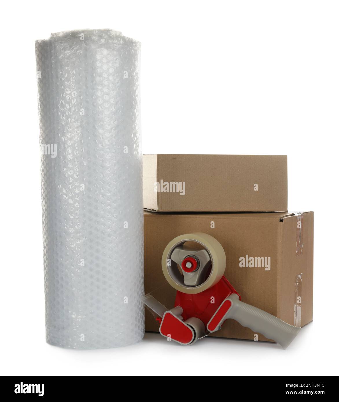 Bubble wrap roll, cardboard boxes and tape dispenser on white