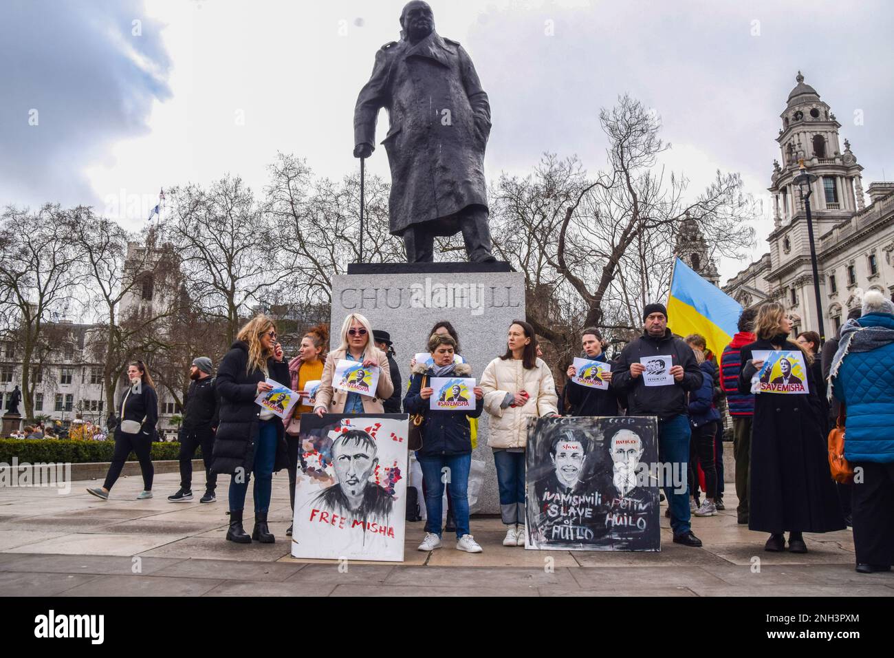 London, UK. 20th Feb, 2023. Protesters hold 'Save Misha' placards and a placard critical of former Georgian Prime Minister Bidzina Ivanishvili and Vladimir Putin during the demonstration in support of Mikheil Saakashvili in Parliament Square. The former Georgian president and governor of Odesa Oblast in Ukraine are currently serving a prison term in Georgia for abuse of power, and his health is said to be deteriorating. (Photo by Vuk Valcic/SOPA Images/Sipa USA) Credit: Sipa USA/Alamy Live News Stock Photo