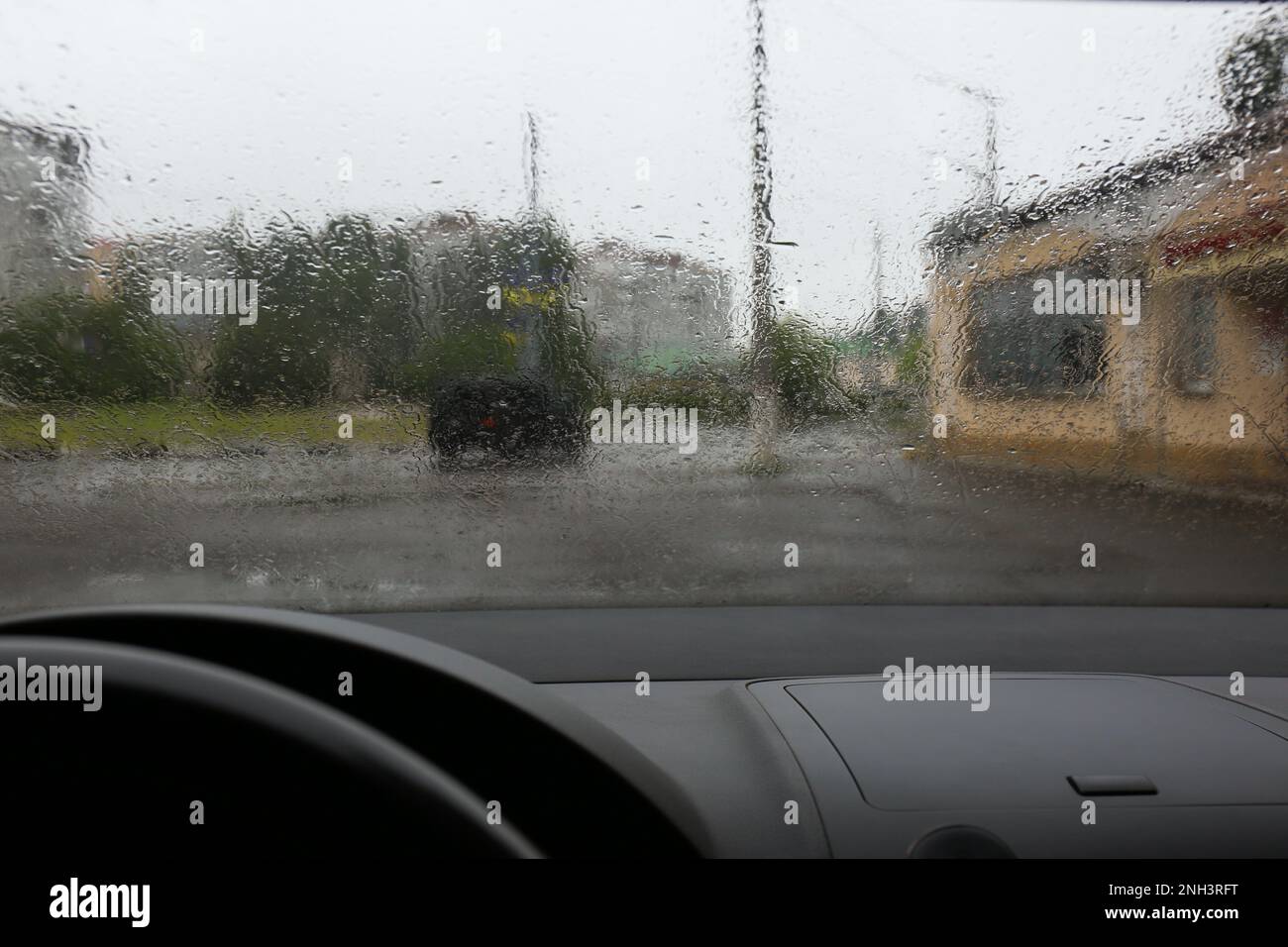 Rain drops on windshield, view from inside Stock Photo