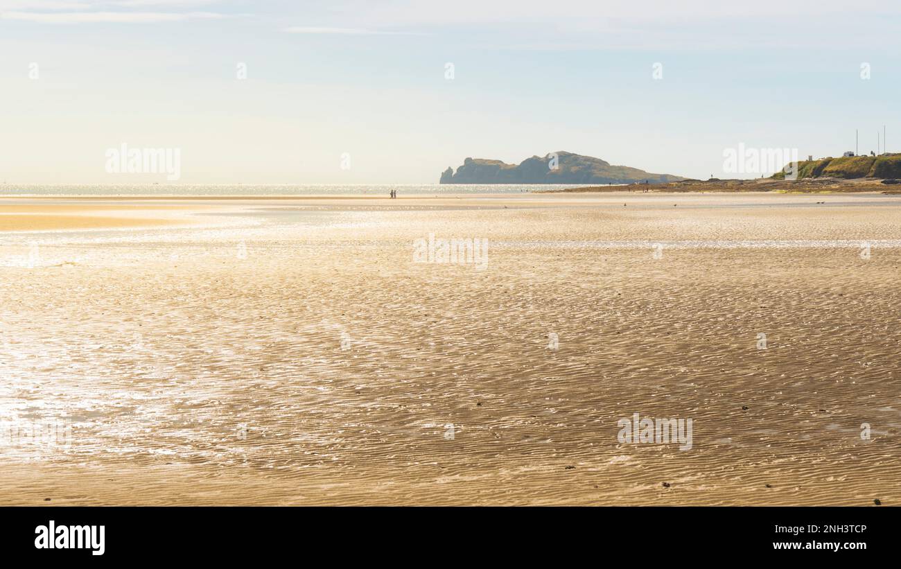 Malahide strand at low tide water with Ireland Eye on background