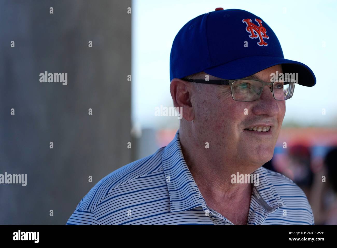 New York Mets owner Steve Cohen walks between fields during spring training baseball practice