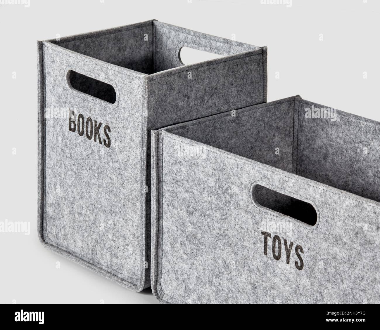 Two gray felt boxes for storing toys and books Stock Photo Alamy