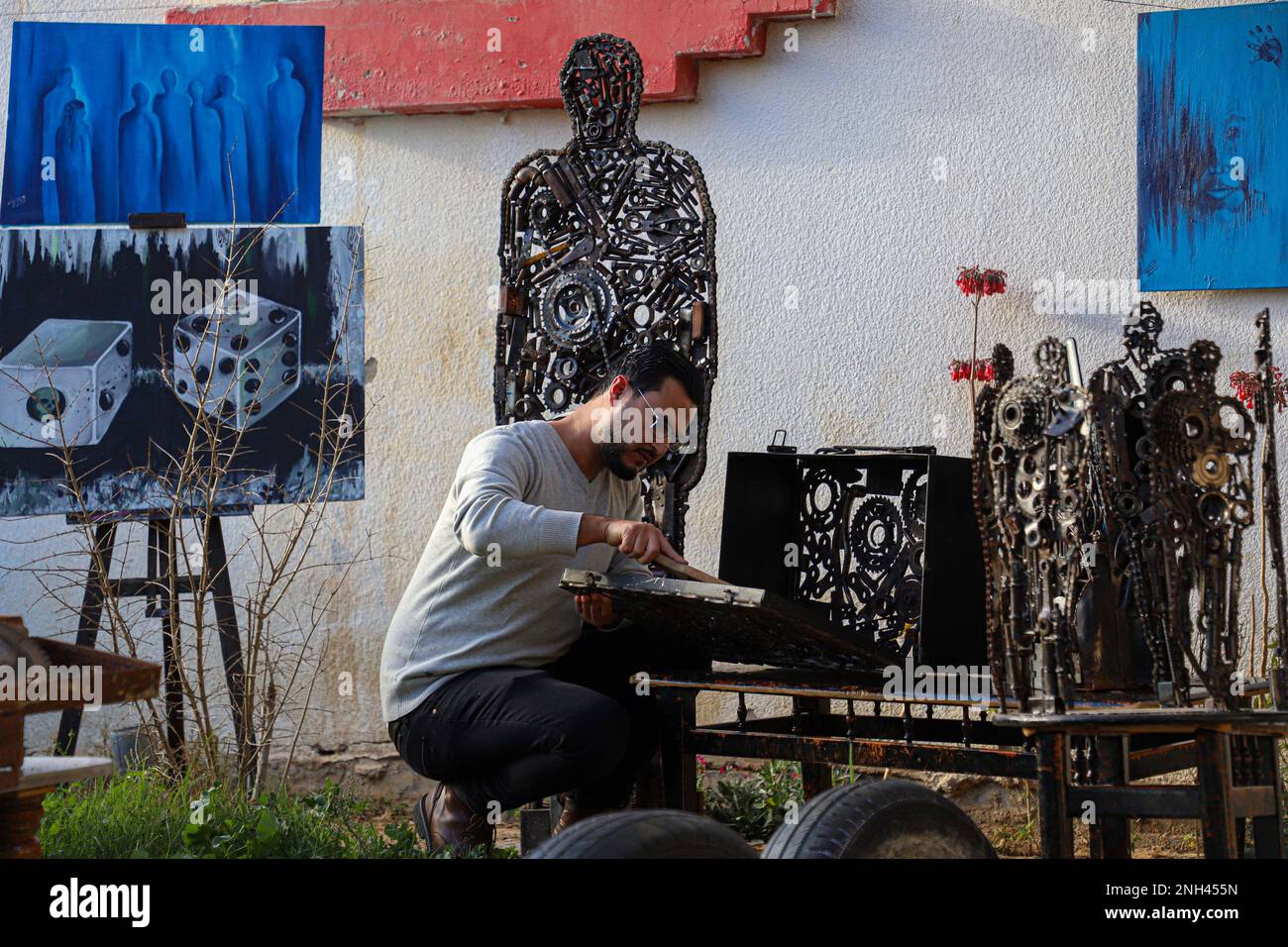 Gaza. 5th Feb, 2023. Palestinian artist Assaf al-Kharti works on an artwork made with recycled scrap at his house in Al-Mughraqa area south of Gaza City, on Feb. 5, 2023. Artists in Gaza, who have lived for years in tension, violence, and hardship under the Israeli blockade, have called attention worldwide to the bleak reality unnoticed by the global audience. Credit: Rizek Abdeljawad/Xinhua/Alamy Live News Stock Photo