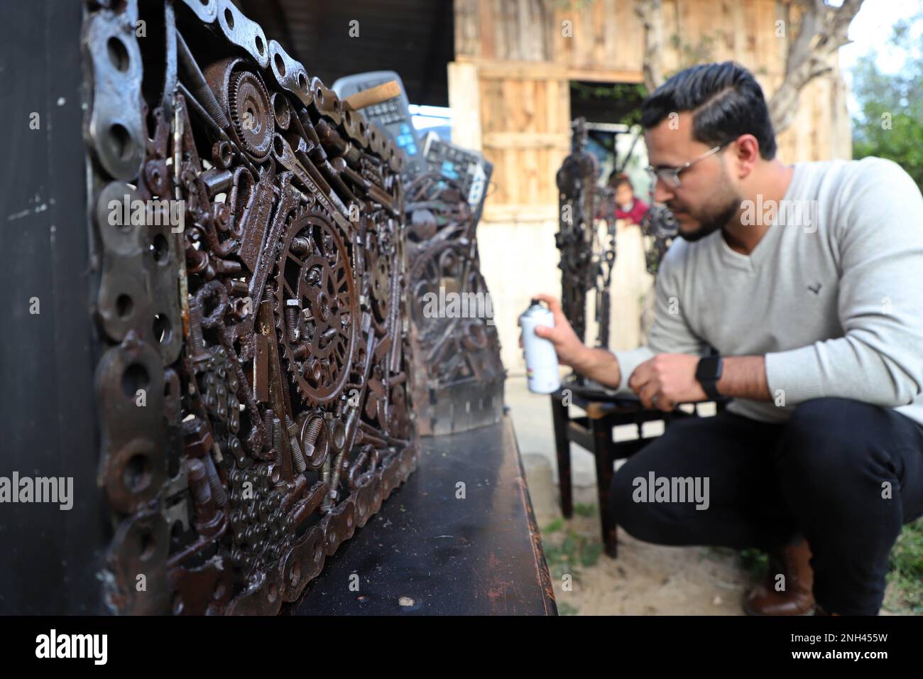 Gaza. 5th Feb, 2023. Palestinian artist Assaf al-Kharti works on an artwork made with recycled scrap at his house in Al-Mughraqa area south of Gaza City, on Feb. 5, 2023. Artists in Gaza, who have lived for years in tension, violence, and hardship under the Israeli blockade, have called attention worldwide to the bleak reality unnoticed by the global audience. Credit: Rizek Abdeljawad/Xinhua/Alamy Live News Stock Photo