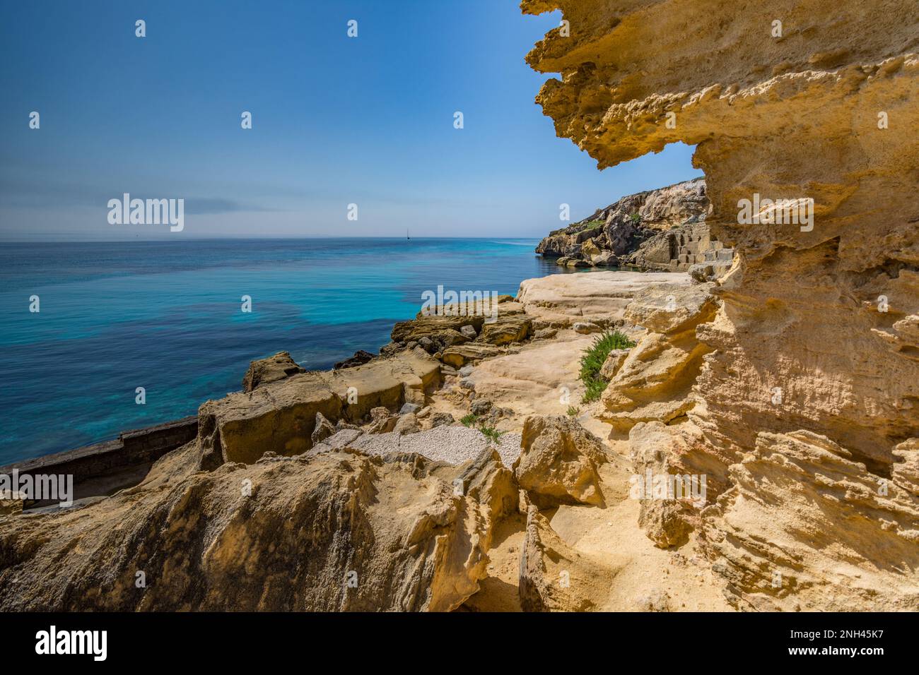 Excavated yellow tuff in Bue Marino cliff, Favignana Stock Photo - Alamy