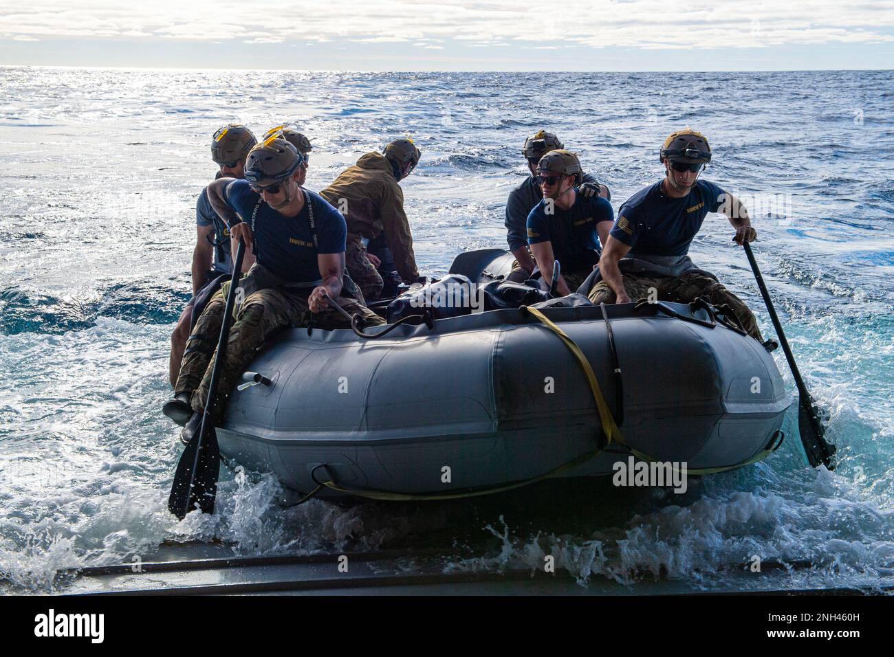 221211-N-NM271-2267 PACIFIC OCEAN (Dec. 11, 2022) Navy Divers attached to Explosive Ordnance Disposal Expeditionary Support Unit One deploy a combat rubber raiding craft from the well deck of amphibious transport dock USS Portland (LPD 27) during the NASA Artemis I Orion spacecraft recovery, Dec. 11, 2022. Portland, along with Independence-variant littoral combat ship USS Montgomery (LCS 8), is underway in U.S. 3rd Fleet in support of the recovery. The retrieval operation is part of a Department of Defense effort that integrates combatant command service capabilities to determine best practice Stock Photo