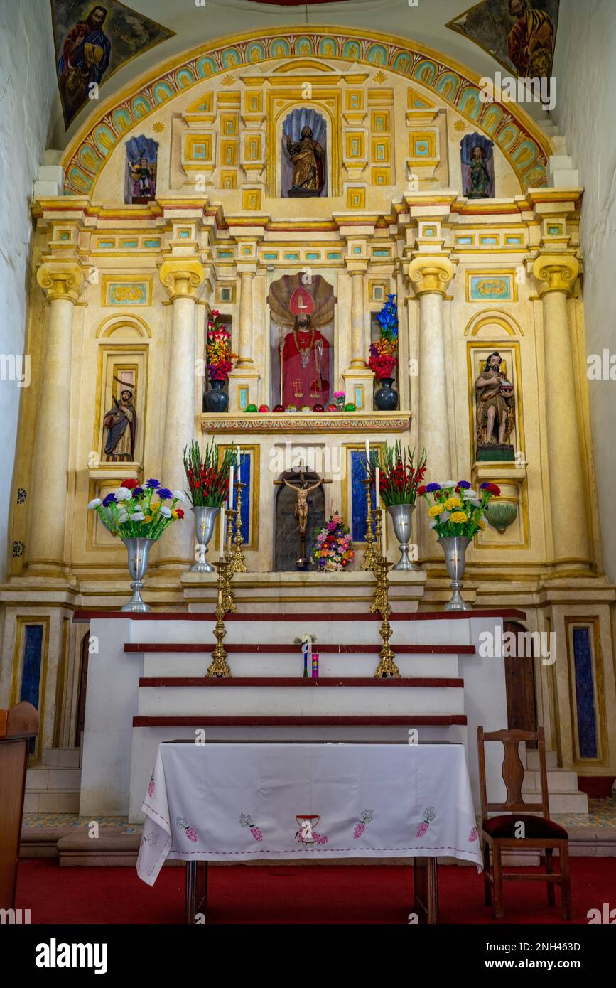 The altar and the altarpiece of the parish church of San Bartolo Coyotepec in the Central Valleys of Oaxaca, Mexico. Stock Photo