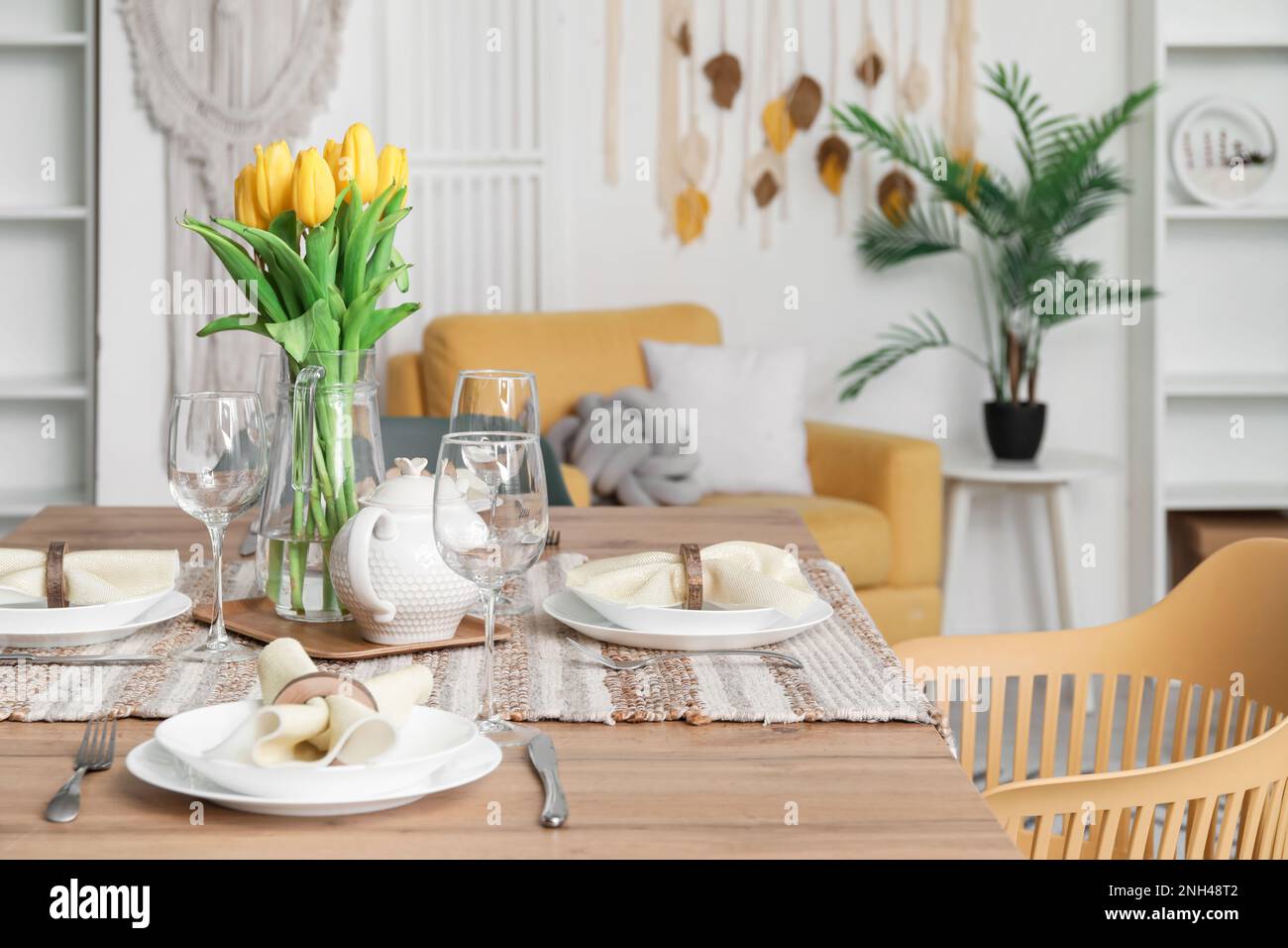 Table setting for International Women's Day celebration with tulip ...