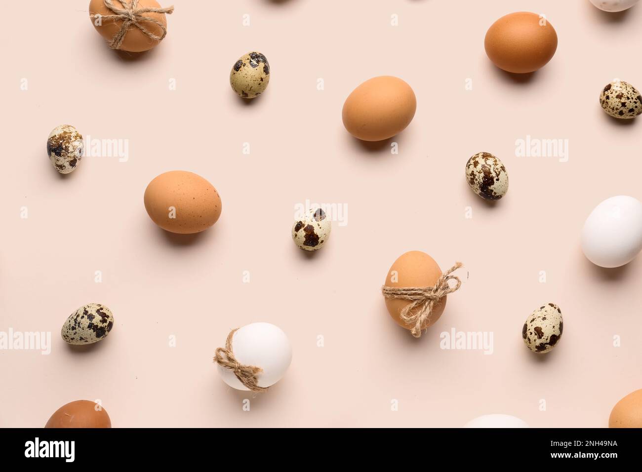 Different Easter eggs on pink background Stock Photo