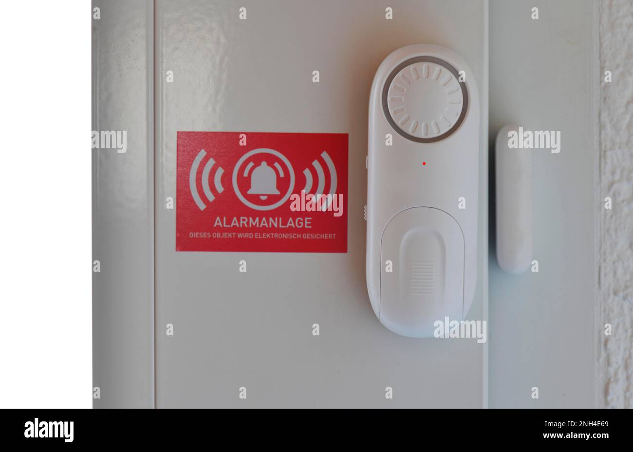 Alarm system with window or door sensors, siren, sticker indicating