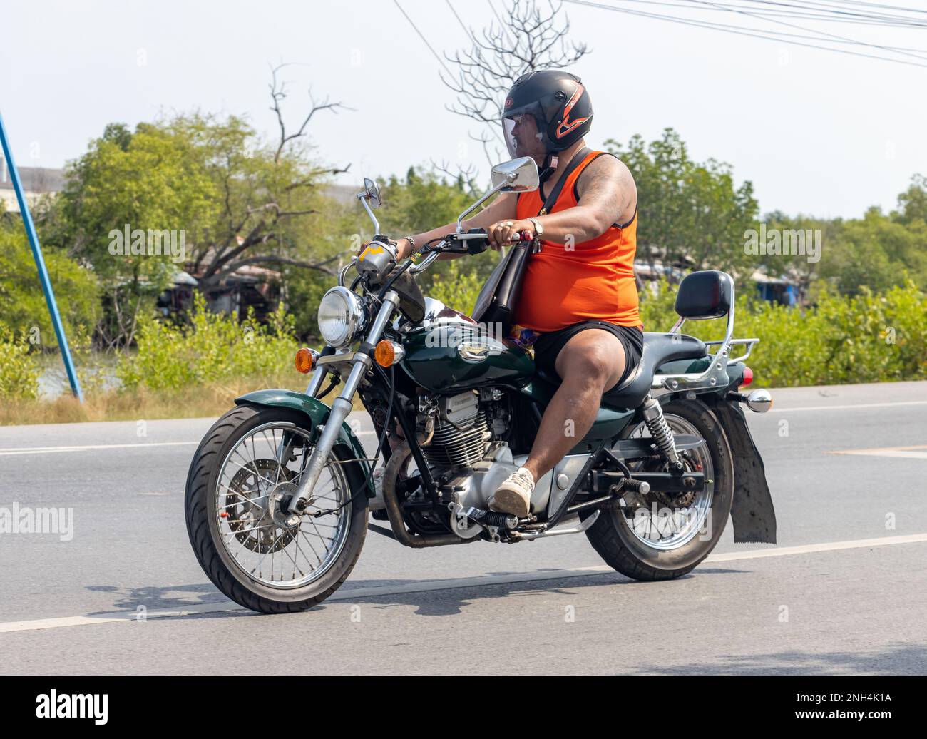 BANGKOK, THAILAND, FEB 07 2023, a man rides a motorcycle Stock Photo