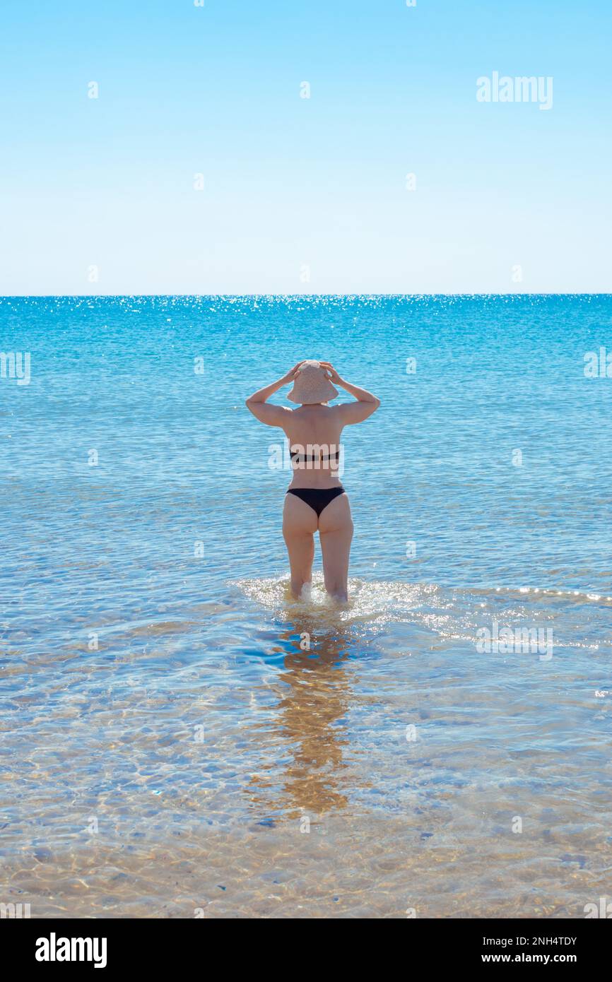 Full Body Shot Of Happy Mature Woman In Bikini Ready For Vacation