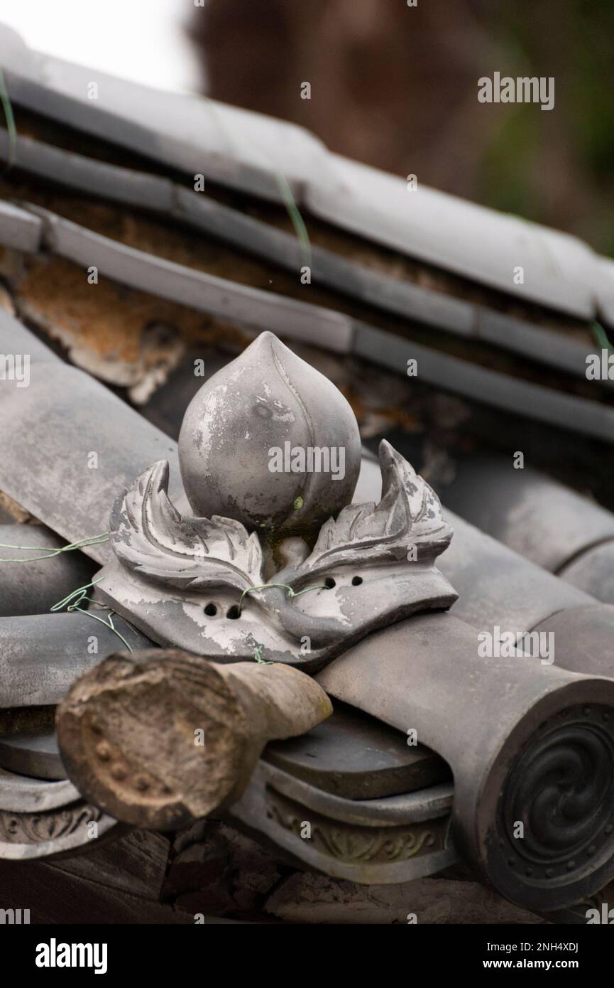 A peach shaped roof tile at Myoshinji Temple, Kyoto, Japan Stock Photo