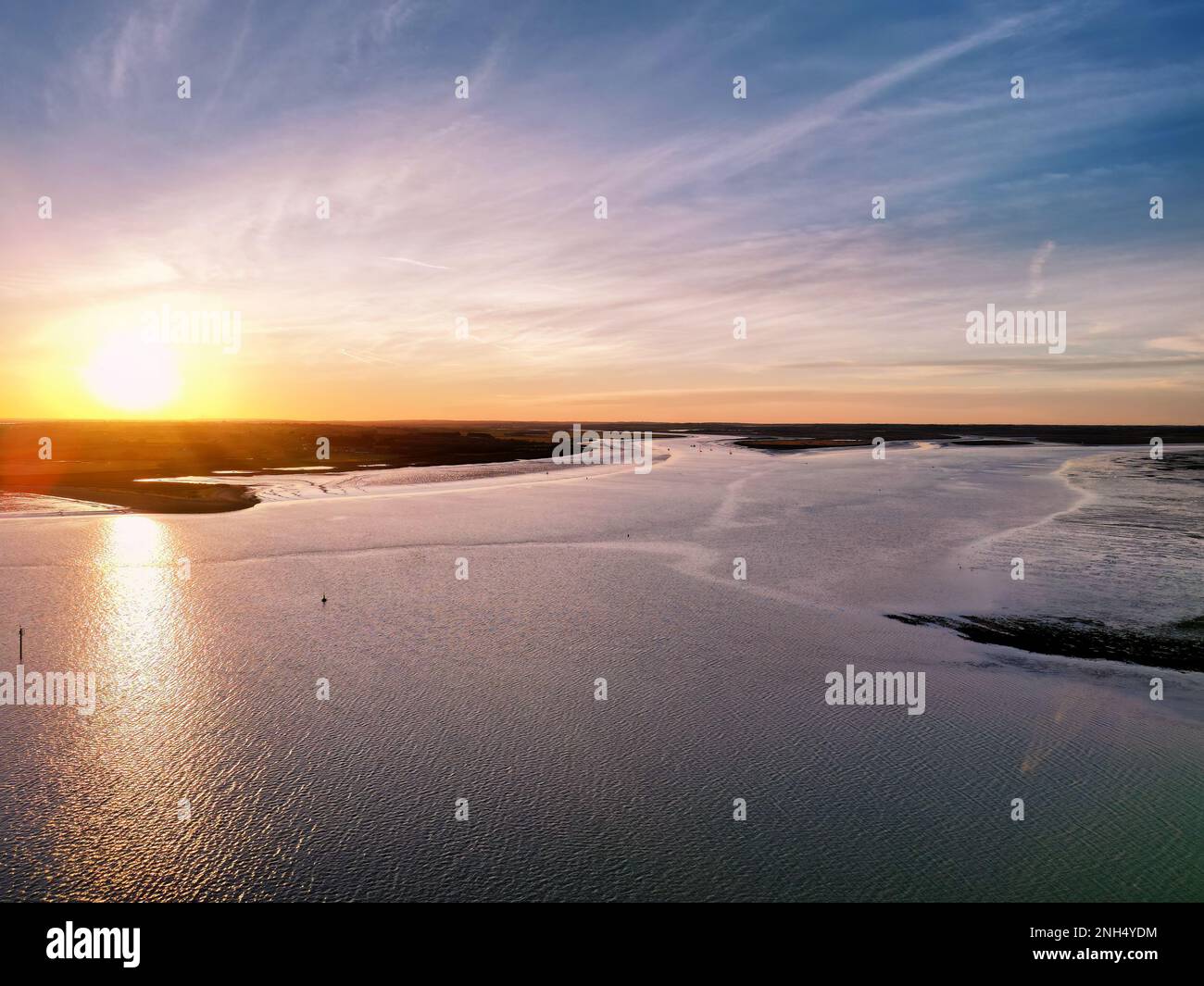Sunset at the River Colne and Brightlingsea Beach in Essex, UK Stock Photo