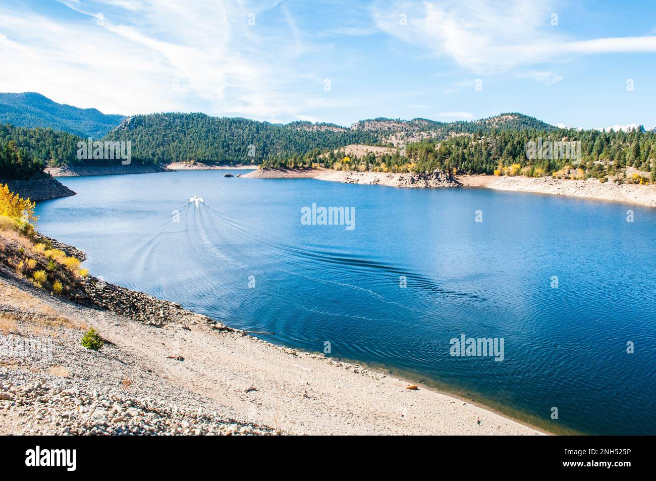 Boat driving across Gross Reservoir, Colorado Stock Photo Alamy