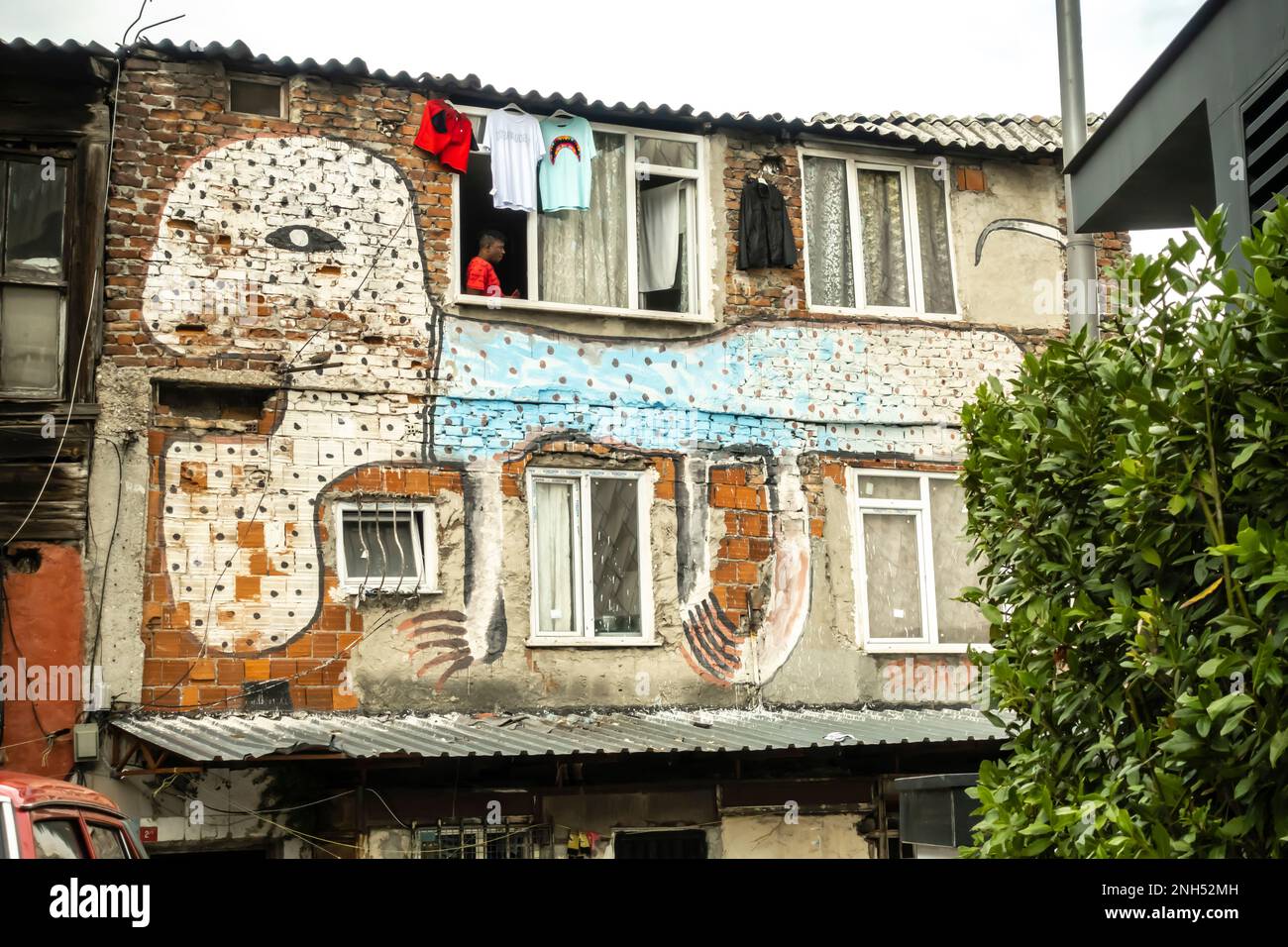 Tiled mural depicting a creature with claws in a neighborhood of Dolapdere Beyoğlu Istanbul Turkey Stock Photo
