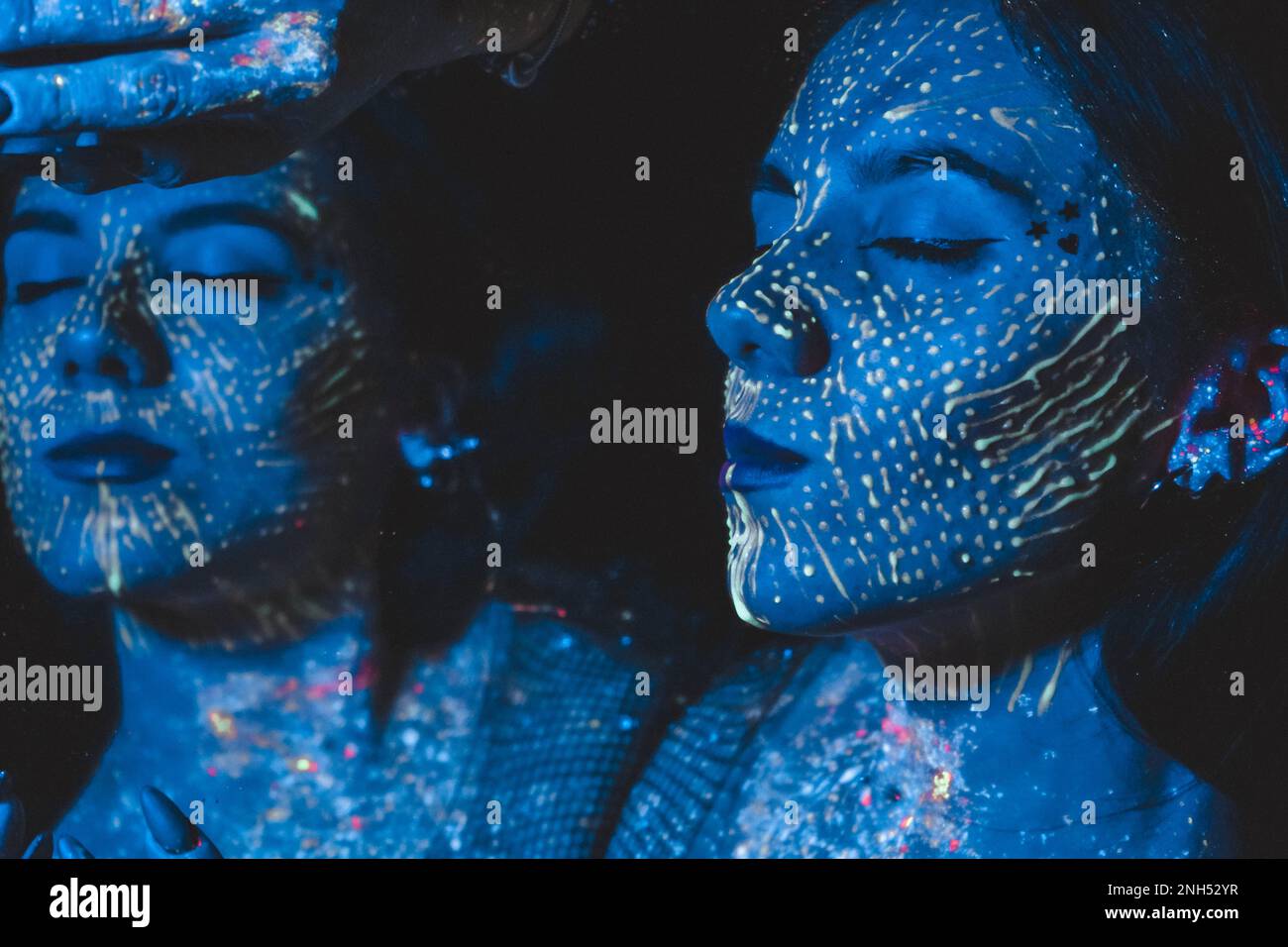 Woman model in neon light, beautiful model girl with fluorescent make ...