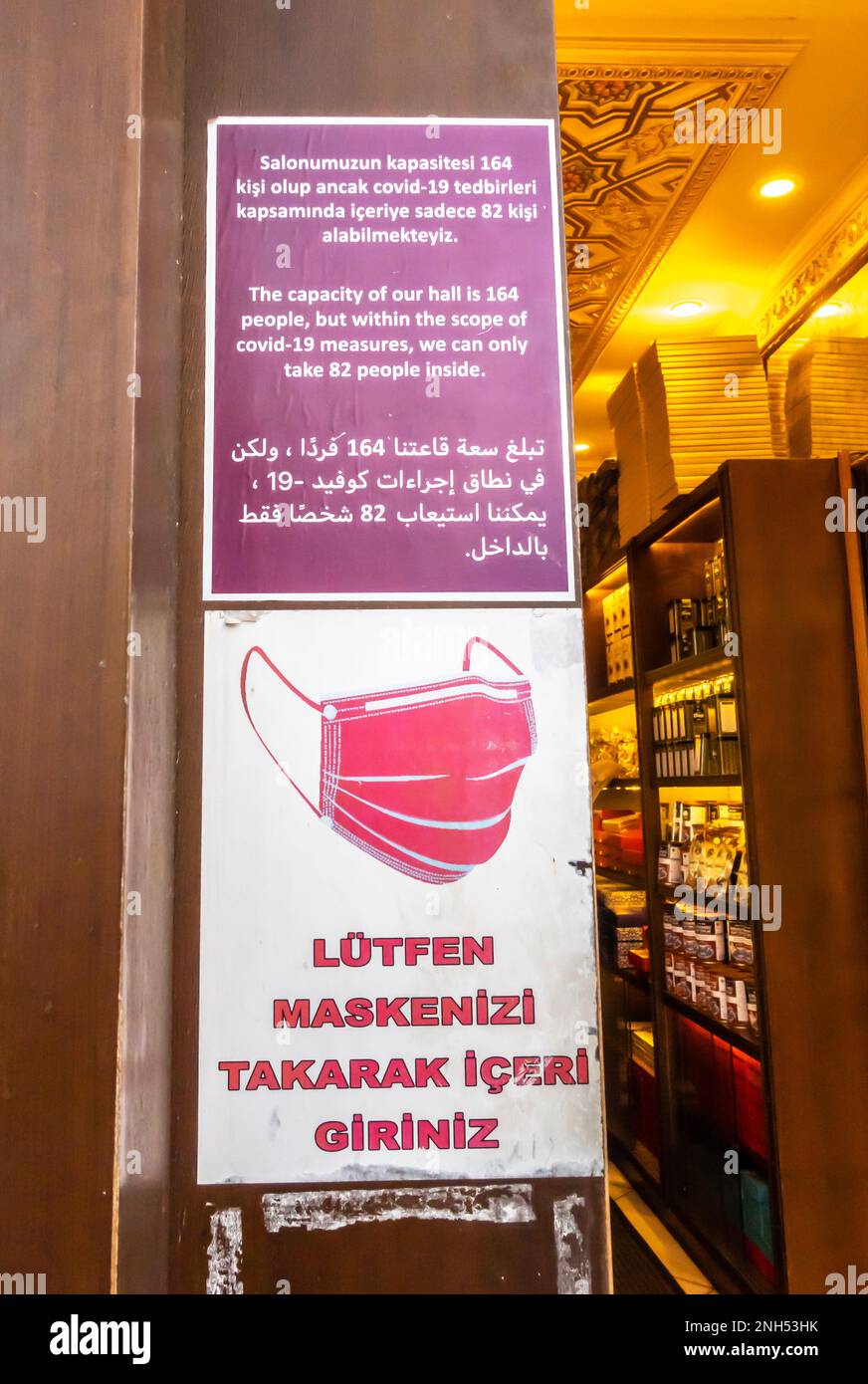 Covid19 prevention rules sign in Istanbul shop in Turkish and Arabic