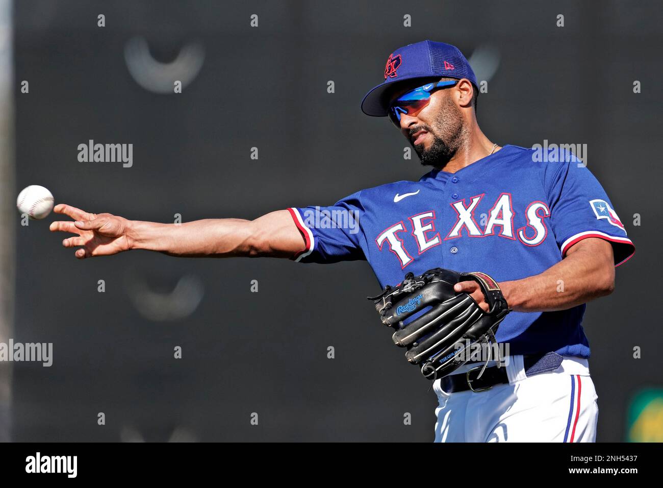 Texas Rangers Leody Taveras throws during spring training baseball practice  Monday, Feb. 20, 2023, in Surprise, Ariz. (AP Photo/Charlie Riedel Stock  Photo - Alamy