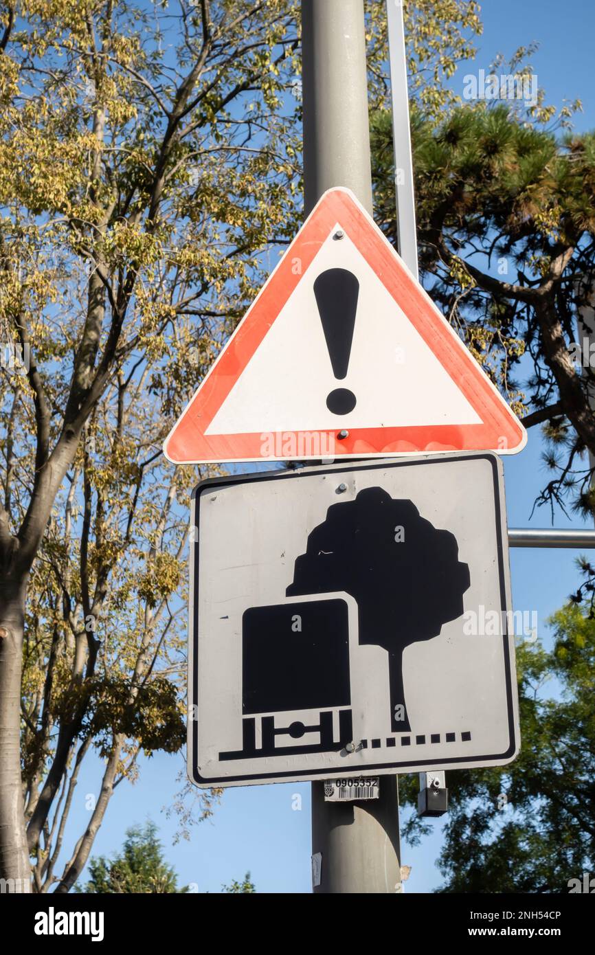 Road sign warning of low tree crone, smashing the tree, graphic signs for trucks warning tree low Istanbul Turkey Stock Photo