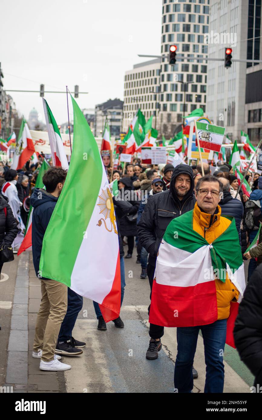 Brussels, Belgium - 20th February 2023: As the session of the EU Parliament convenes in Brussels, tens of thousands of Iranian diaspora, representing anti-regime opposition groups, have congregated. The massive crowd stretches as far as the eye can see and fills the streets leading up to the parliament building. The protesters are mainly holding pictures of Mahsa Amini, Reza Pahlavi, and of the recent victims of the regime's violence. They are also waving the Shir-o-Khorshid flag of Iran and chanting 'Woman, Life, Freedom' and 'Democracy for Iran. Credit: Sinai Noor/Alamy Live News Stock Photo
