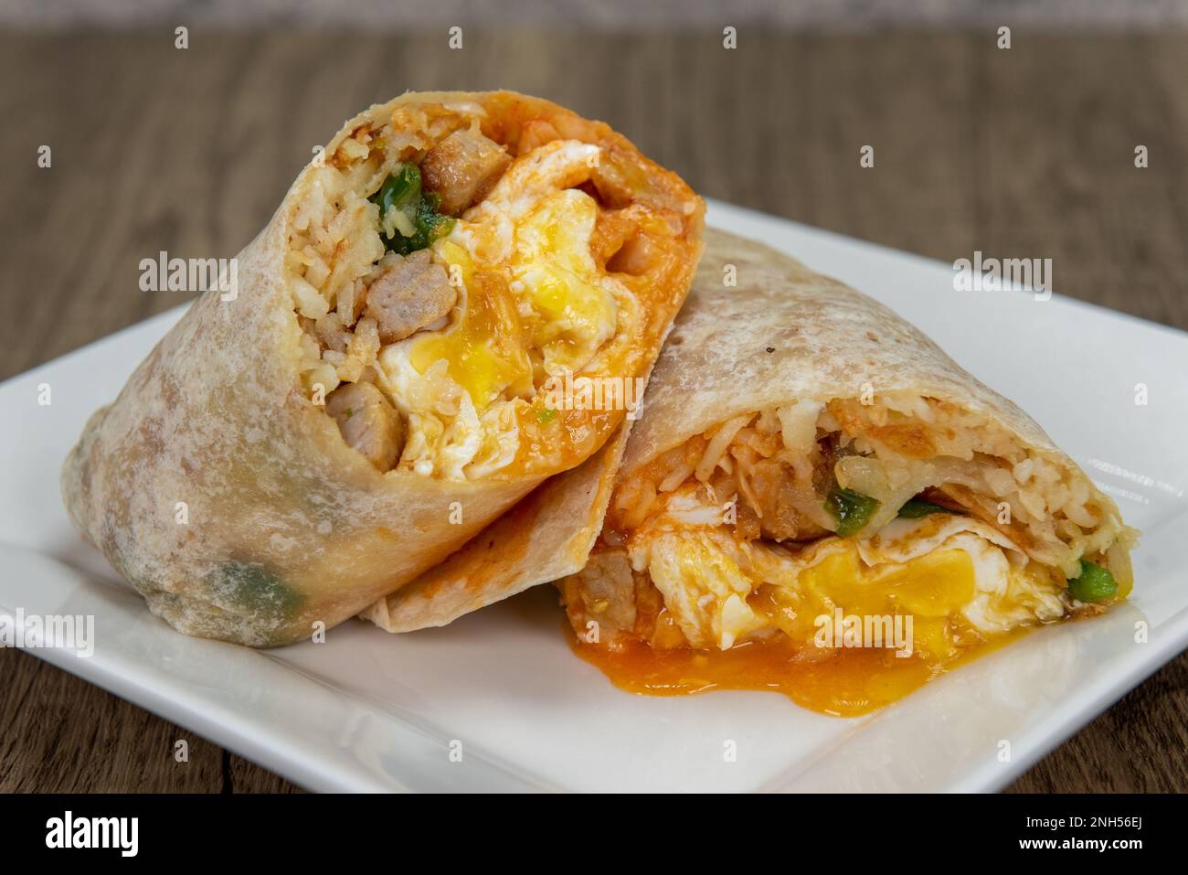 Loaded spicy egg and cheese breakfast burrito all wrapped in a grilled