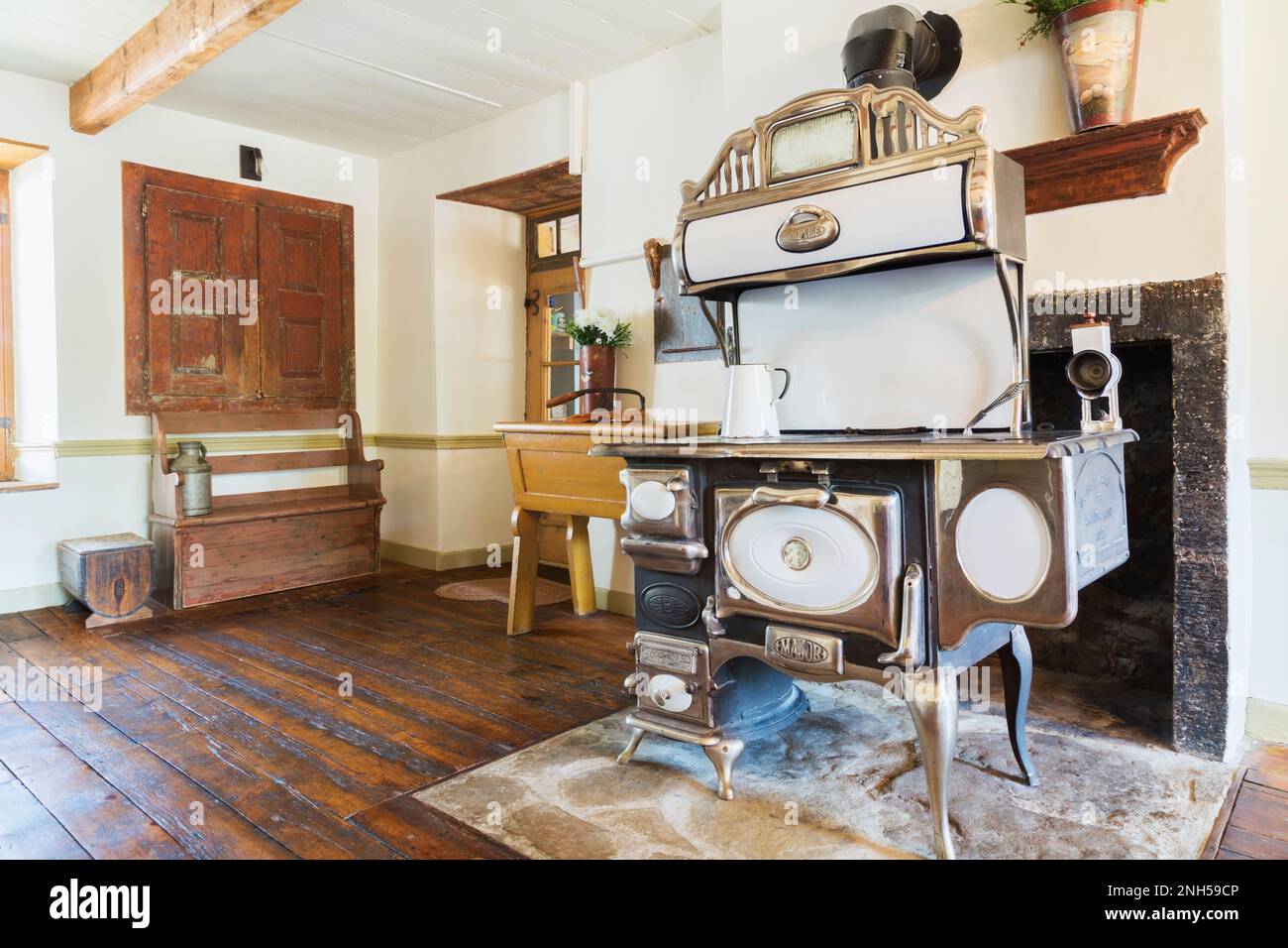 Belanger 'Major' wood burning cooking stove and antique wooden sitting