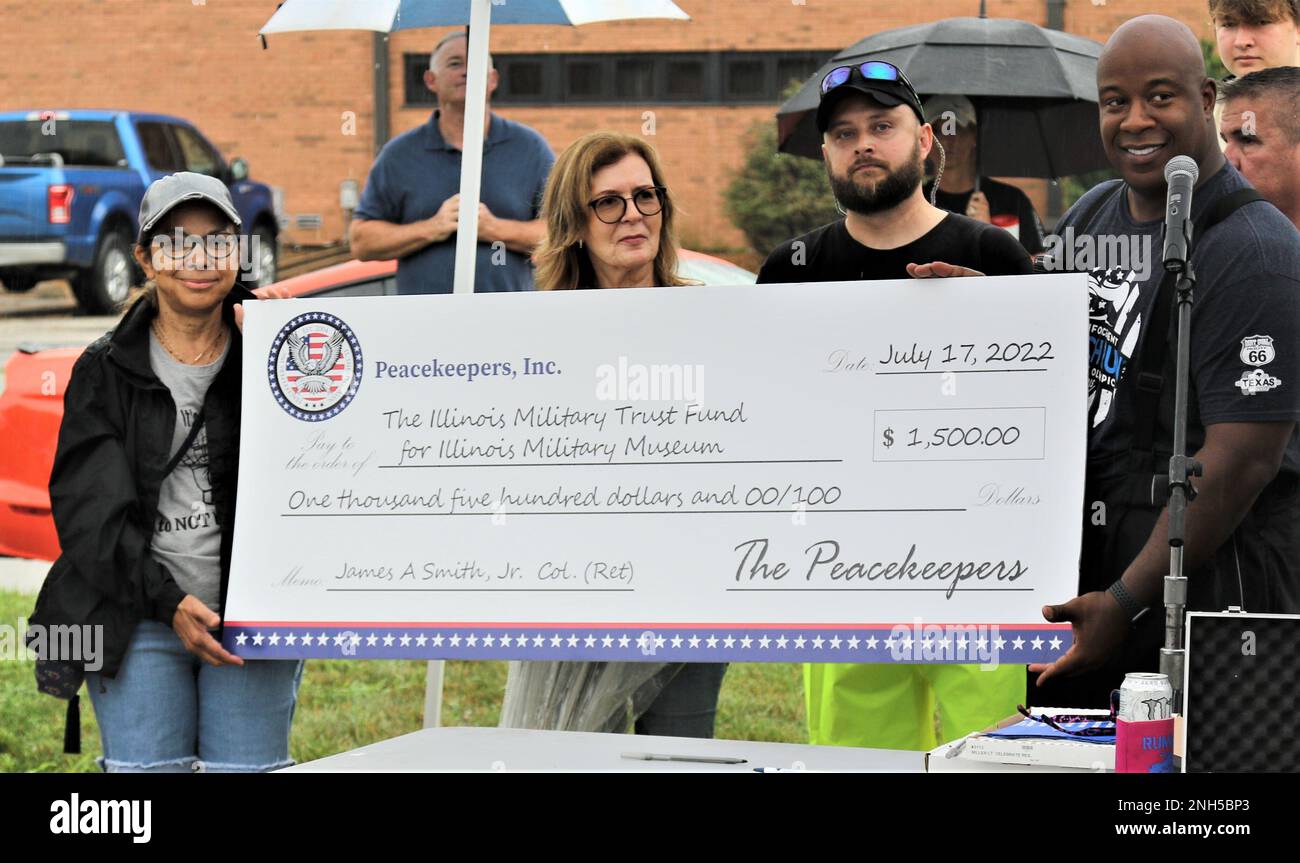 Nilsa Smith, the widow of Col. James Smith, accepts a giant 1,500