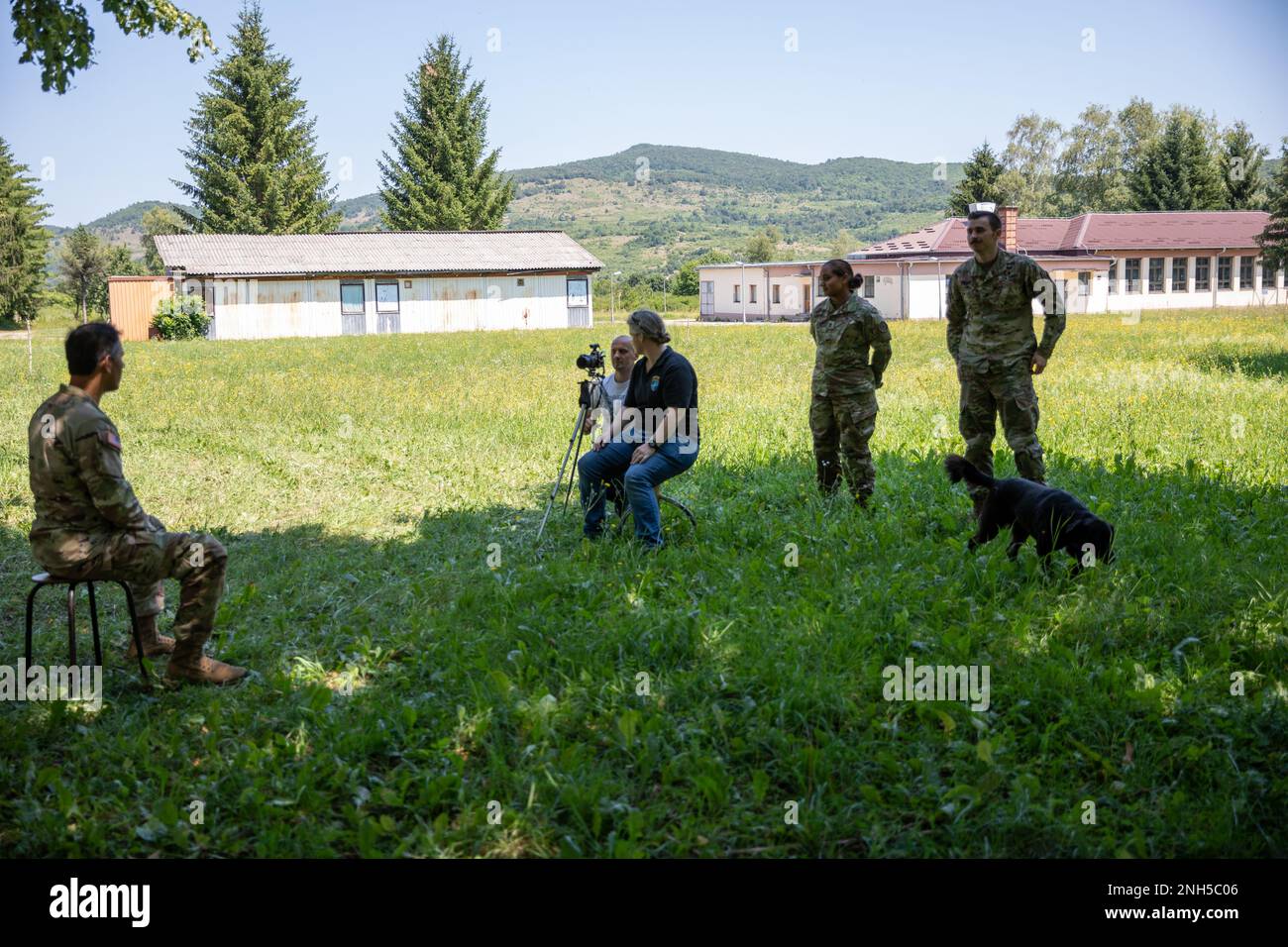 U.S. Army Maj. Kritis Dasgupta (left), a field surgeon with the Maryland Medical Detachment, is interviewed by NATO HQ Sarajevo at Kasarna Manjaca, Dobrnja, Bosnia and Herzegovina on July 17, 2022. Guard members assigned to the State Medical Detachment and 1-169th Aviation Regiment, Maryland Army National Guard, trained alongside active duty Soldiers from the 1st Squadron, 91st Cavalry Regiment, 173rd Airborne Brigade, 12th Combat Aviation Brigade, and the Armed Forces of Bosnia and Herzegovina soldiers in tactics, aviation, medical, and non-commissioned officer development. The Maryland Natio Stock Photo