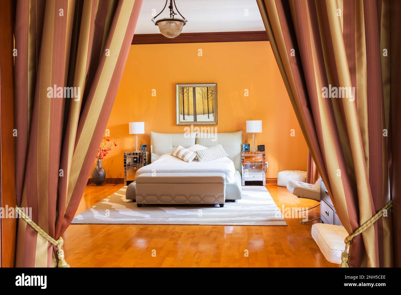 Queen size bed with grey leather upholstered base and headboard in