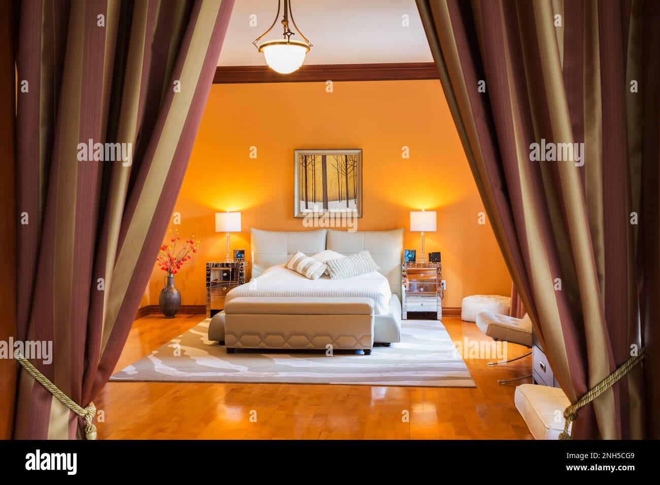 Queen size bed with grey leather upholstered base and headboard in