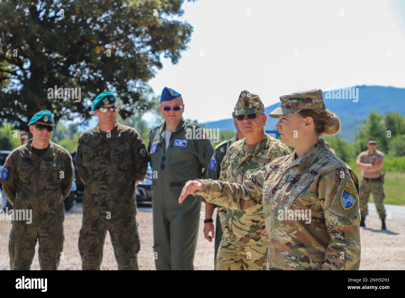 Brig. Gen. Pamela L. McGaha (right), Commander of NATO HQ Sarajevo, conducts a site visit at Kasarna Manjaca, Dobrnja, Bosnia-Herzegovina on July 17, 2022. Guard members assigned to the State Medical Detachment and 1-169th Aviation Regiment, Maryland Army National Guard, trained alongside active duty Soldiers from the 1st Squadron, 91st Cavalry Regiment, 173rd Airborne Brigade, 12th Combat Aviation Brigade, and the Armed Forces of Bosnia and Herzegovina soldiers in tactics, aviation, medical, and non-commissioned officer development. The Maryland National Guard will celebrate 20 years of partn Stock Photo