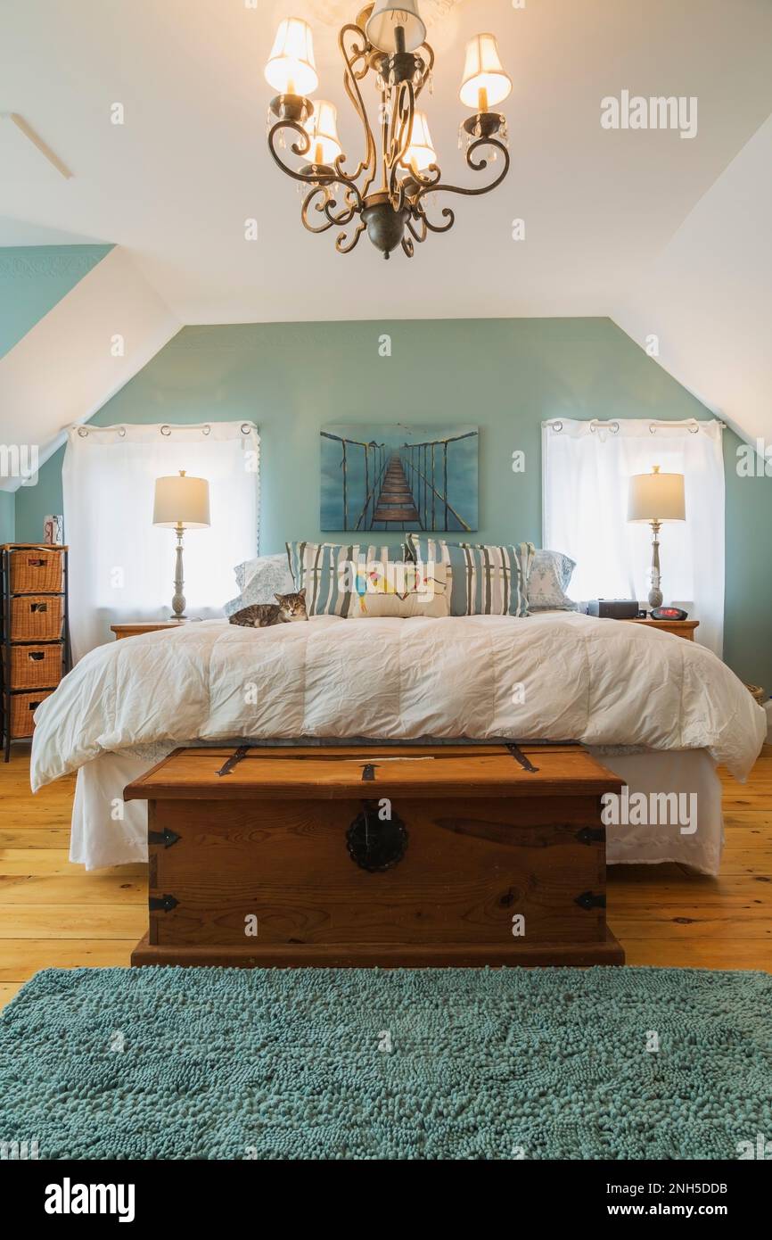 Queen size bed with pine wood nightstands, chest in upstairs master
