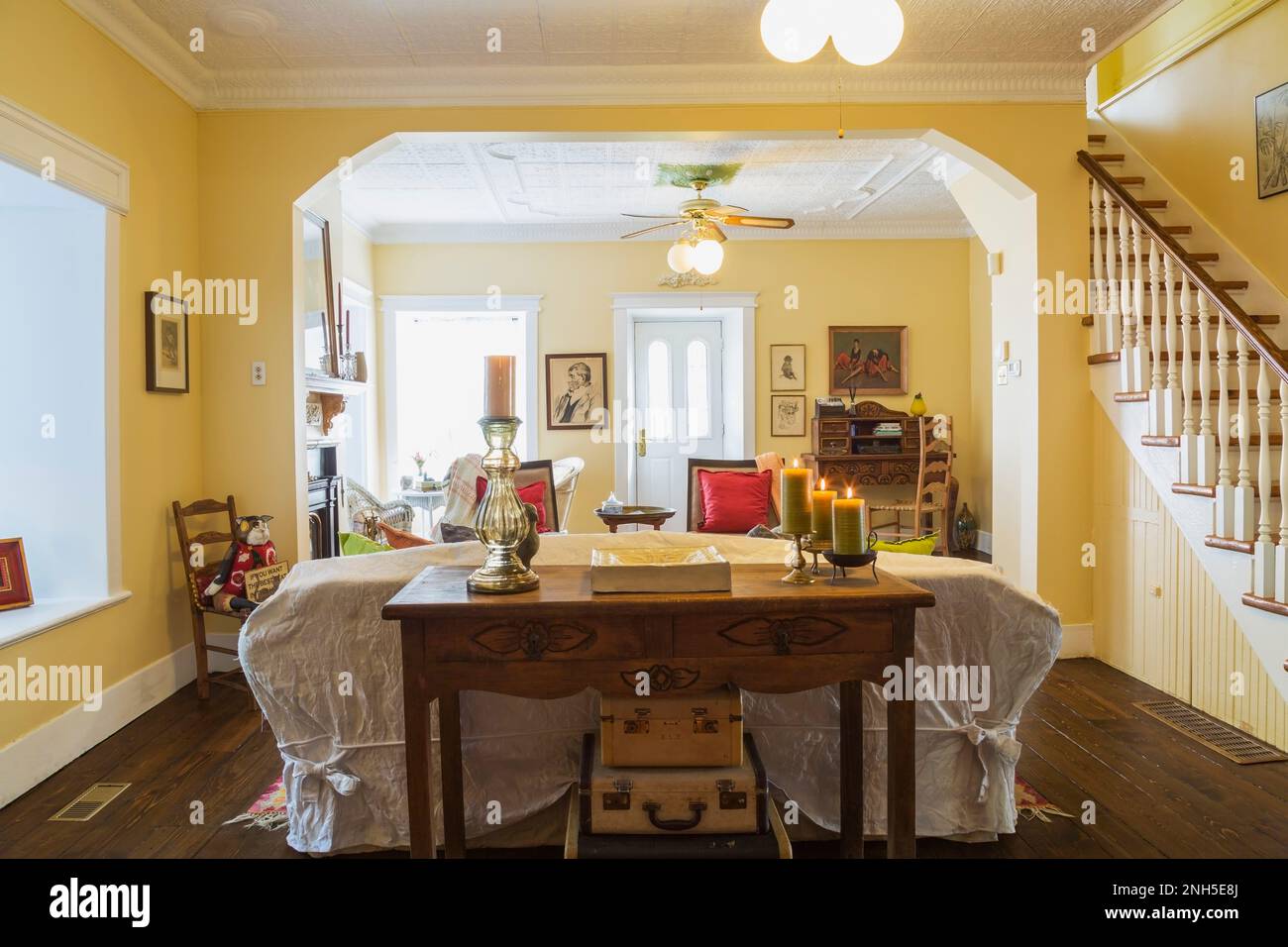 Antique wooden console table, sofa, Eclectic chairs and secretary desk