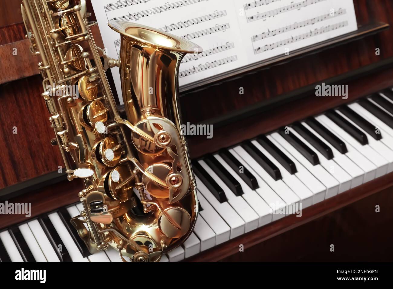 Beautiful saxophone on piano keys. Musical instruments Stock Photo Alamy