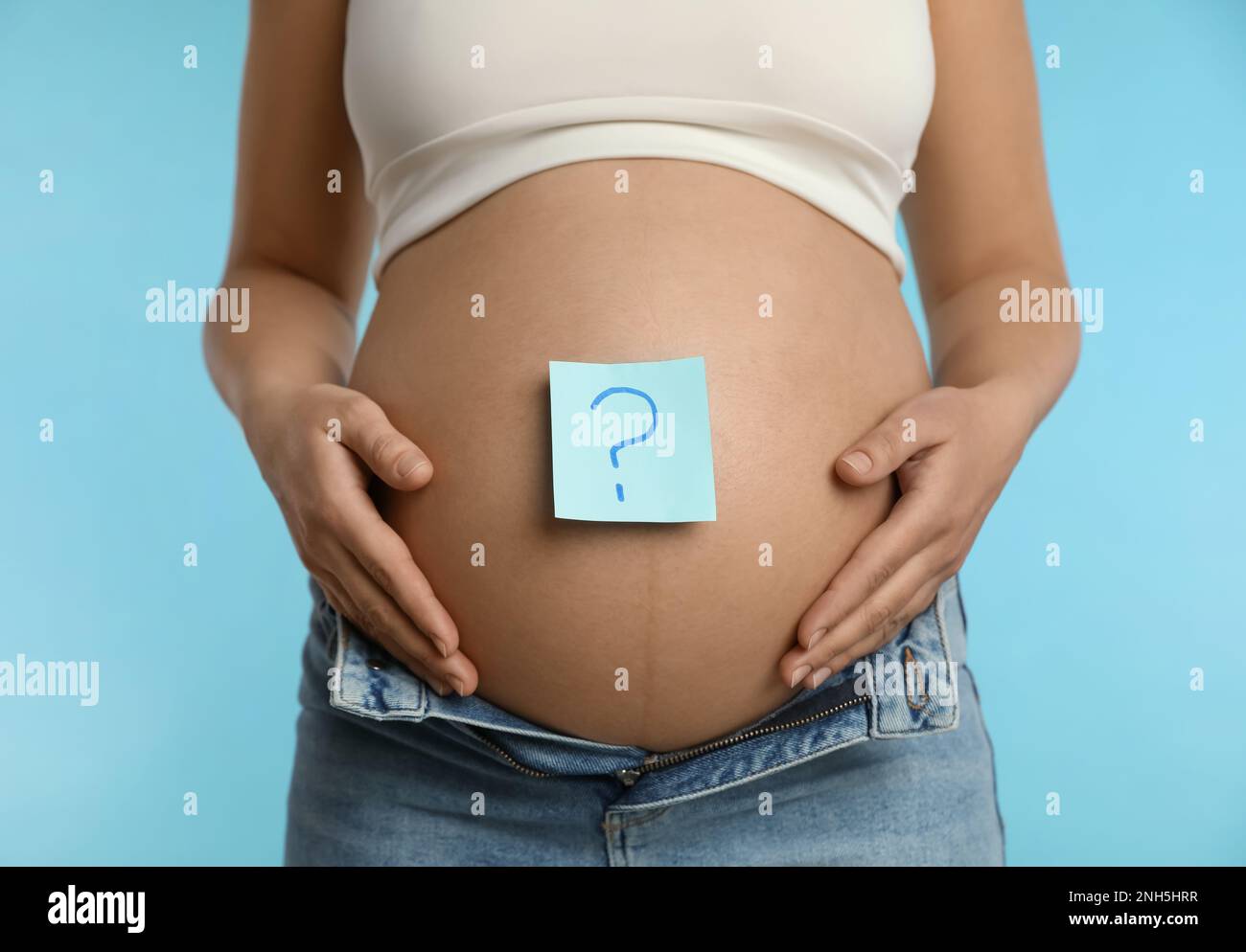 Question mark on a sticker of men's panties. The question on paper glued to  men's underwear. Stock Photo