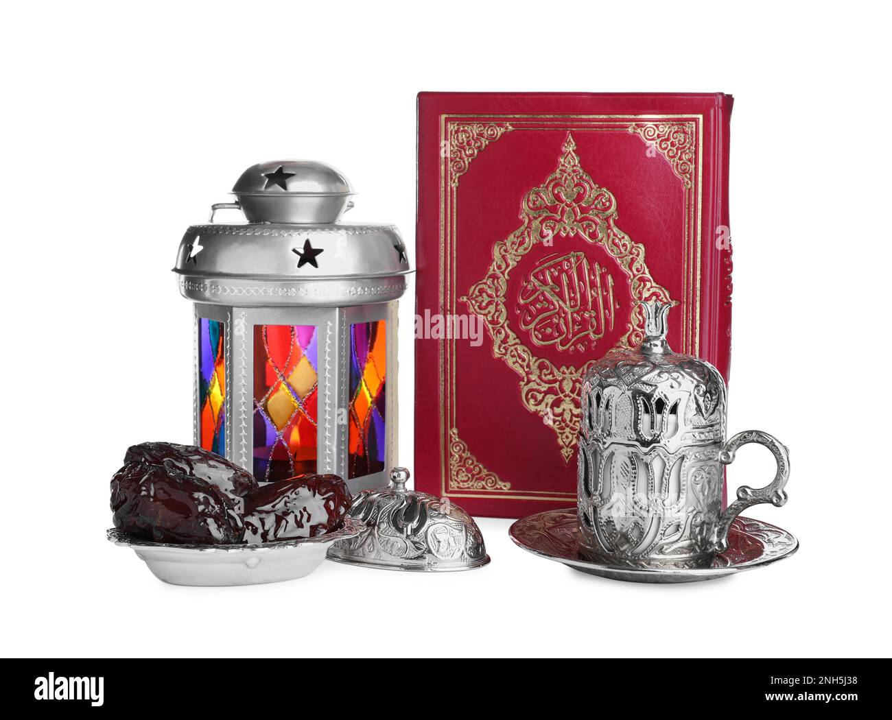Decorative Arabic lantern, Quran, dates and coffee on white background