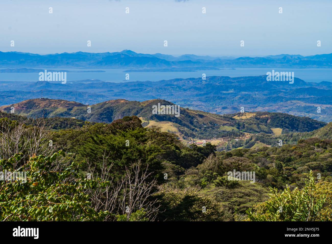 view from the hills above Monteverde Cloud Forest towards the Pacific Ocean Stock Photo