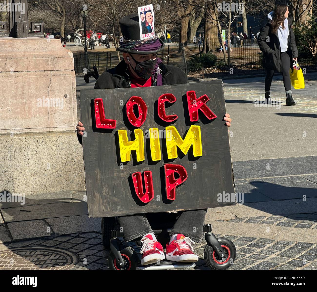 New York City, United States. 20th February, 2022. Dozens of demonstrators gathered in front of the Trump Tower in Columbus Circle, New York City with Anti-Trump Administration banners and signs. Credit: Ryan Rahman/Alamy Live News Stock Photo