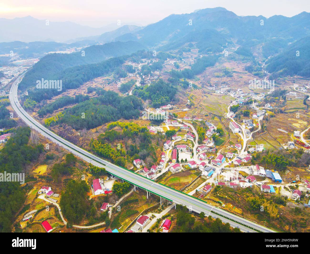 ANQING CHINA FEBRUARY 21 2023 A Highway Passes Through A Village anqing-china-february-21-2023-a-highway-passes-through-a-village