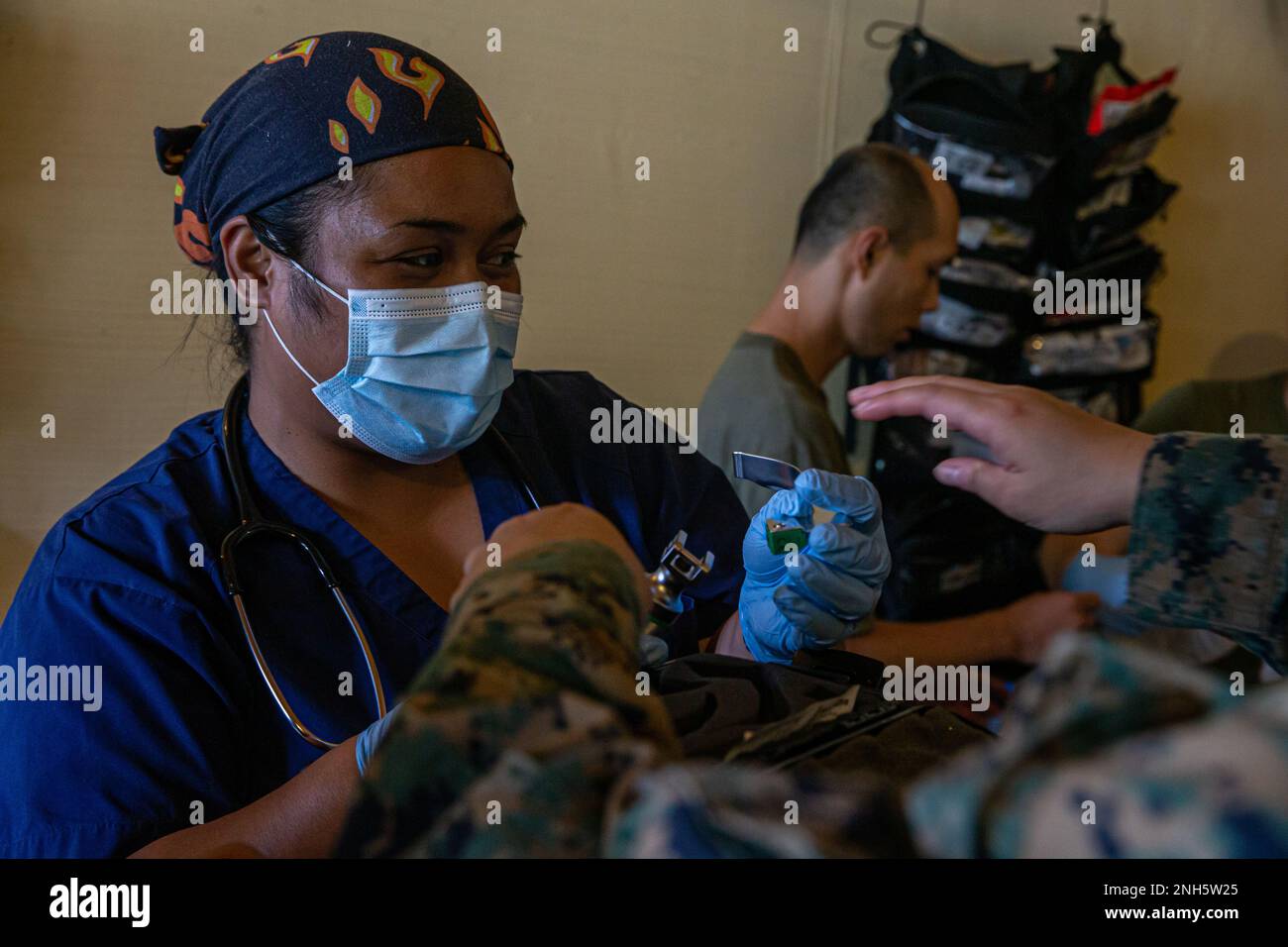 Rachel Arurang, an intern physician with the Belau National Hospital, prepares a laryngoscope to intubate a simulated casualty during a mass casualty training event in Koror, Republic of Palau, July 18, 2022. Koa Moana is designed to improve interoperability with local agencies and strengthen relationships between the U.S. and partner nations in support of U.S. Indo-Pacific Command strategic and operational objectives. Stock Photo