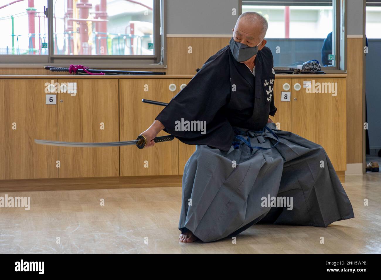 A member of the Kendo Federation from Shunan city demonstrates a unique  form of martial arts called “laido” at Marine Corps Air Station Iwakuni,  Japan, July 18, 2022. MCAS Iwakuni youth had